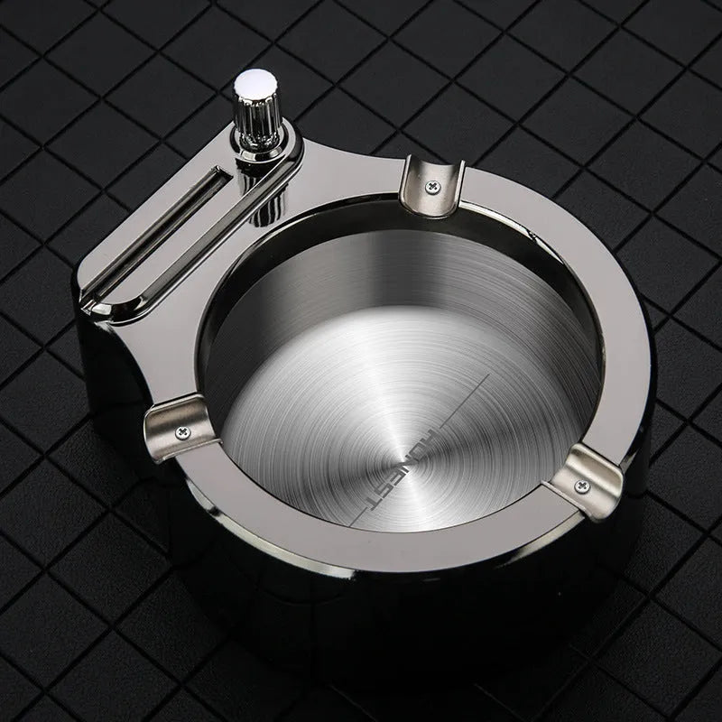 Large brushed stainless steel ashtray with sliding permanent match lighter and three cigarette slots in gold colour