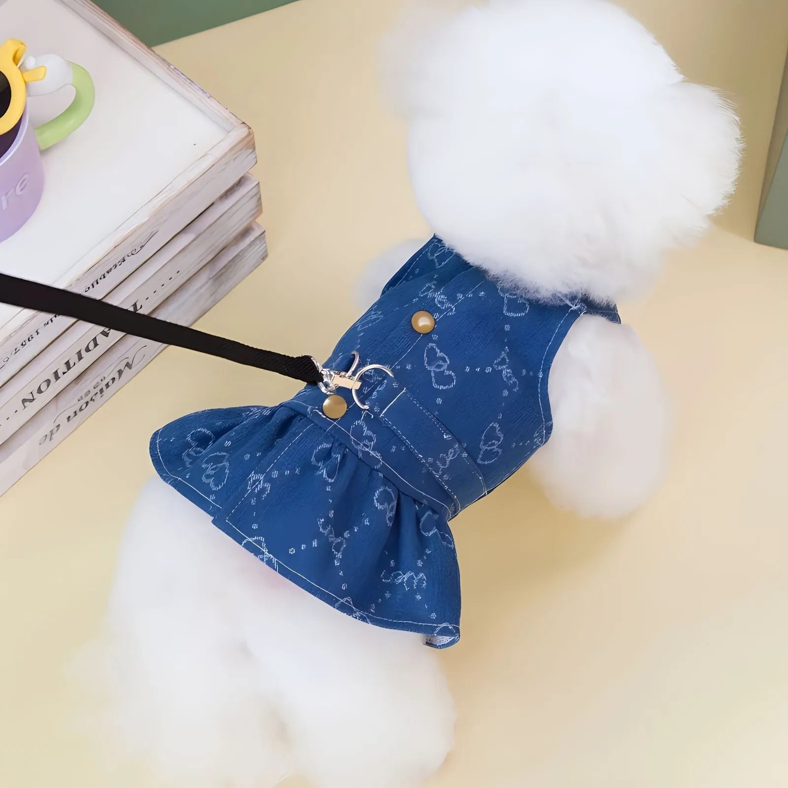 Small dog wearing a light blue denim princess dress with a bracket skirt, suitable for spring or autumn.