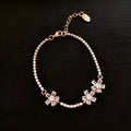 Gold tone quadrilateral geometry women's bracelet with inlaid zircon elements on copper