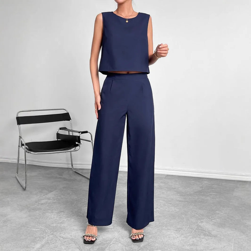 Red women's two-piece set with sleeveless top and wide leg trousers