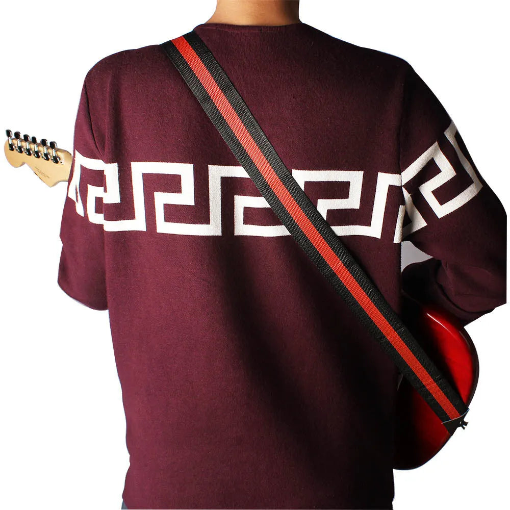 Universal woven guitar, bass, and ukulele strap shown in one of five colour options.