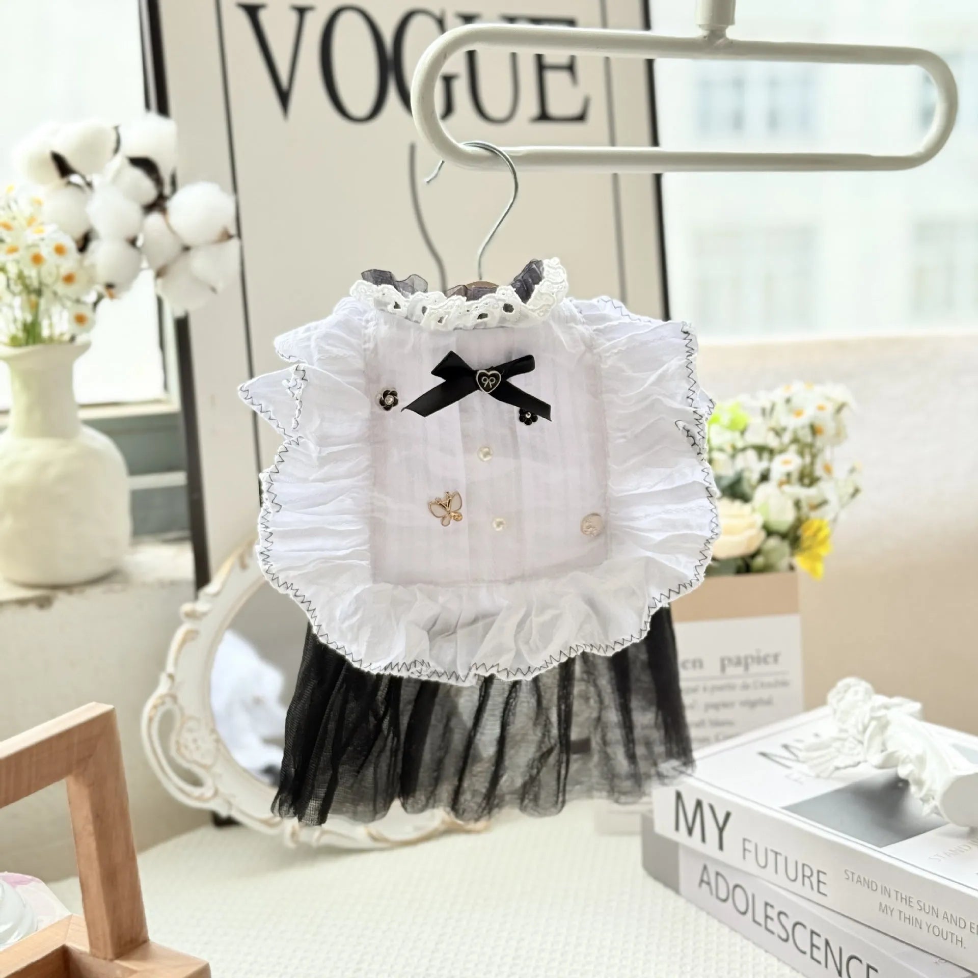 White polyester princess-style waltz gauze skirt for a small dog on a hanger.