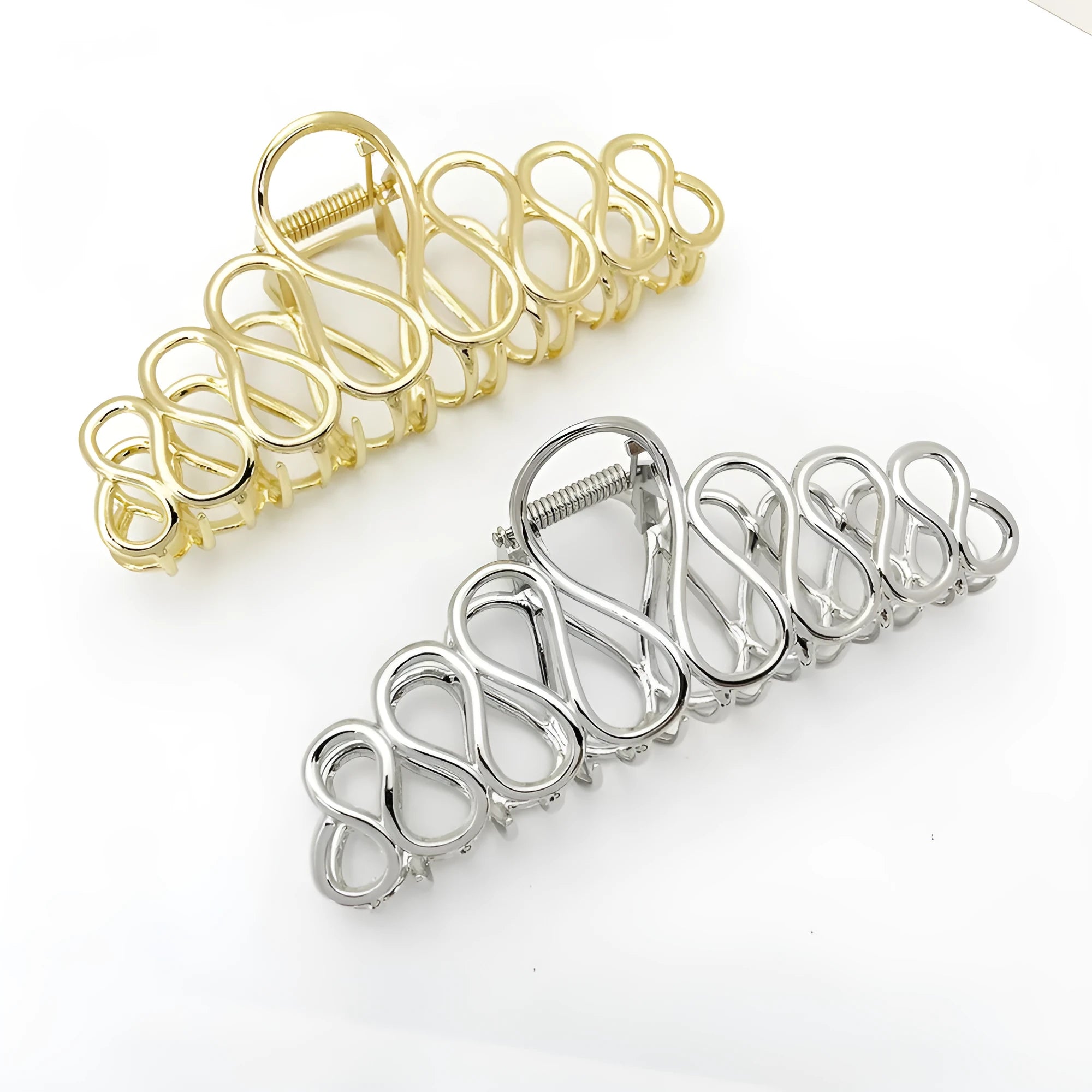Minimalist large hair clip with electroplated alloy construction and tassel accents in gold or silver colour