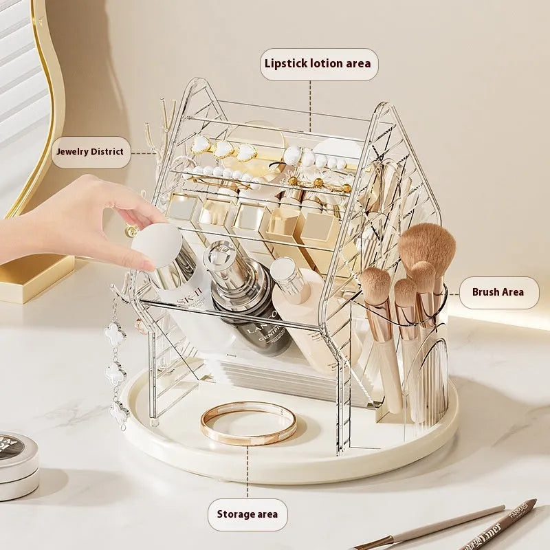Rotating clear plastic cosmetic storage box organiser on a table.
