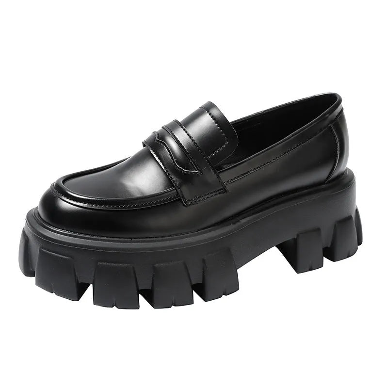 Men's wide fit British style loafers in patent leather with a rubber sole and muffin heel.