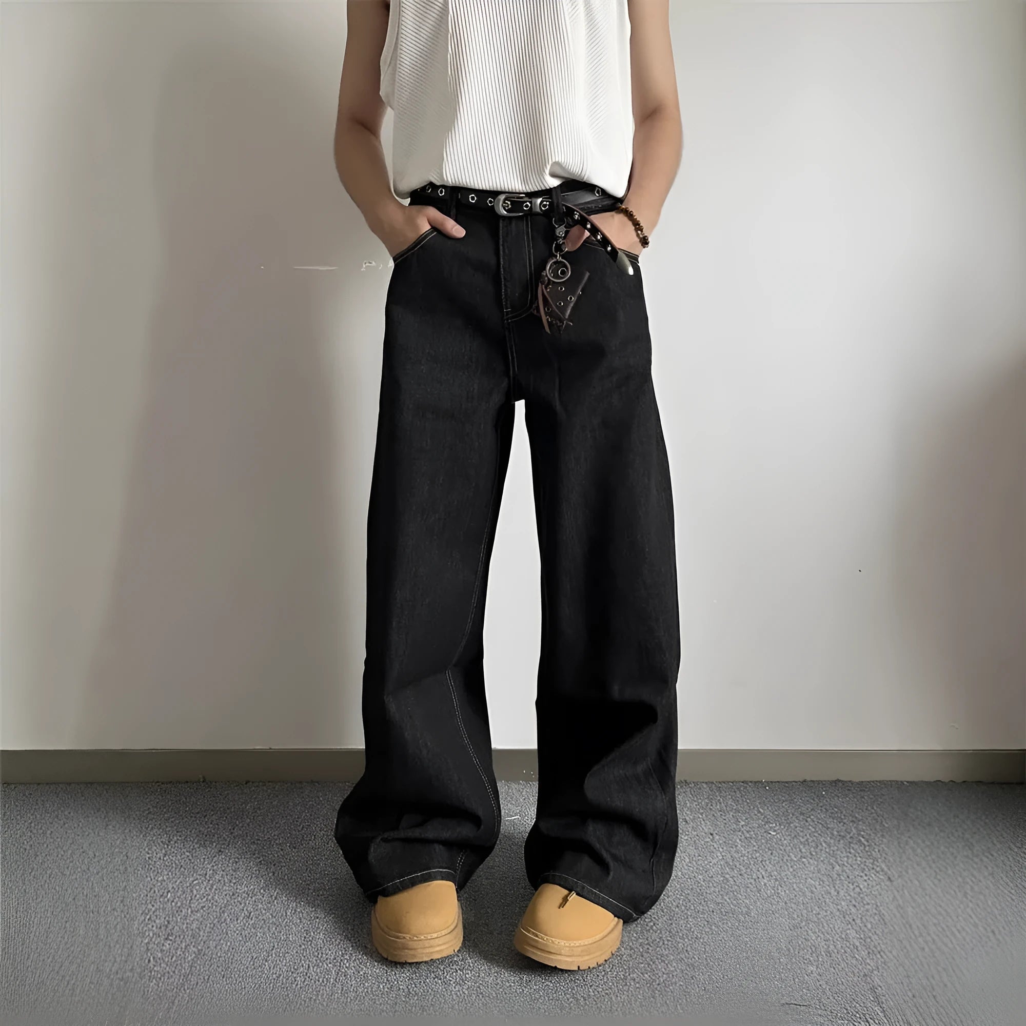 Black loose wide-leg straight-leg retro jeans on a hanger, showing zip fly and mid waist.