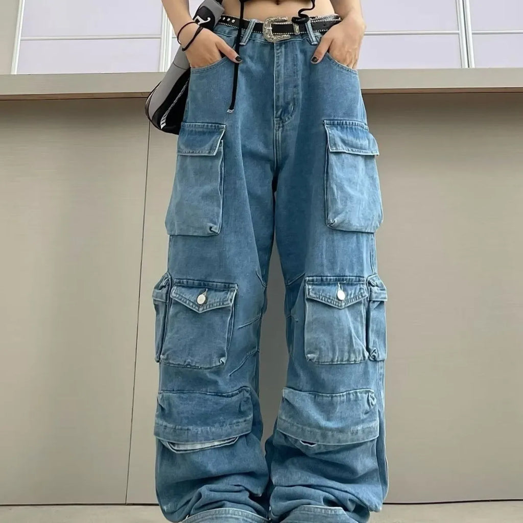 Woman wearing blue tie-dyed high waist wide leg jeans with multiple pockets in a street style setting.