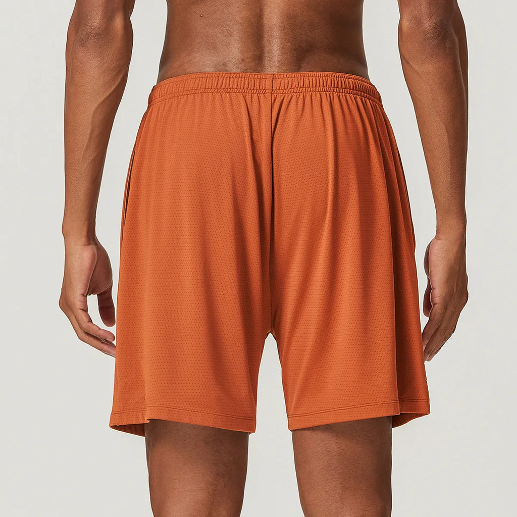 Man wearing sky blue double-layer quick-dry running shorts with a mid-waist fit.