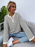 Women's black striped loose top with drop-shoulder sleeves and button details