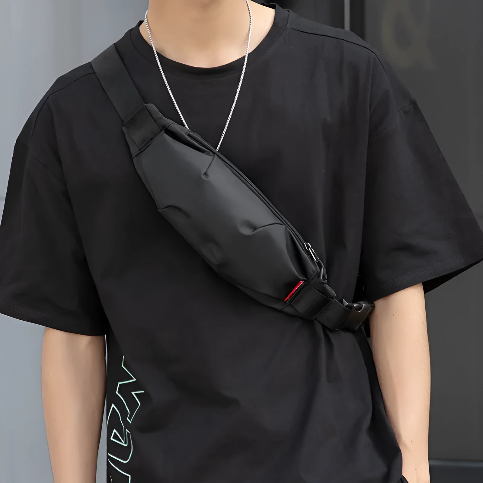 Black Oxford cloth waist pack with crossbody strap showing multiple interior compartments