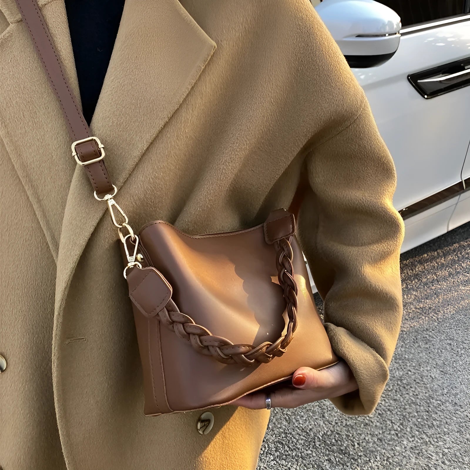 Retro unisex brown PU bucket bag with woven detail, shown with crossbody strap.