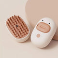 White rechargeable steam pet brush with rubber comb teeth and water tank for dog and cat grooming