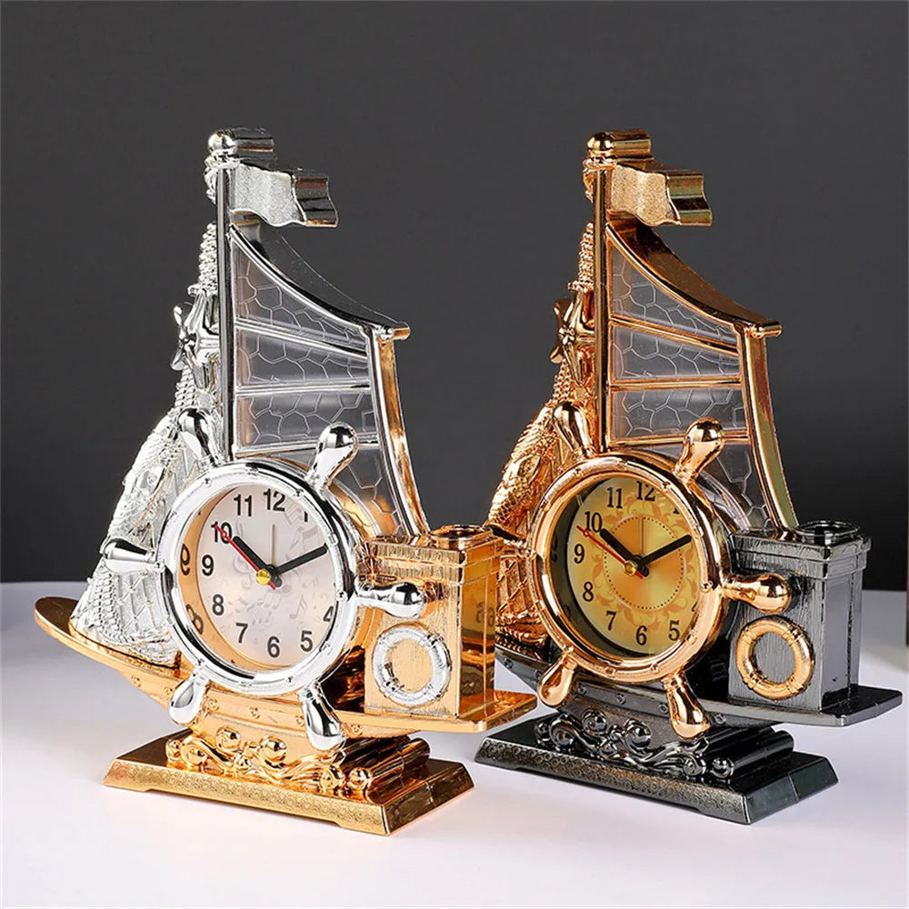 Fashion bedroom alarm clock in choice of gold or silver metallic finish on a surface.