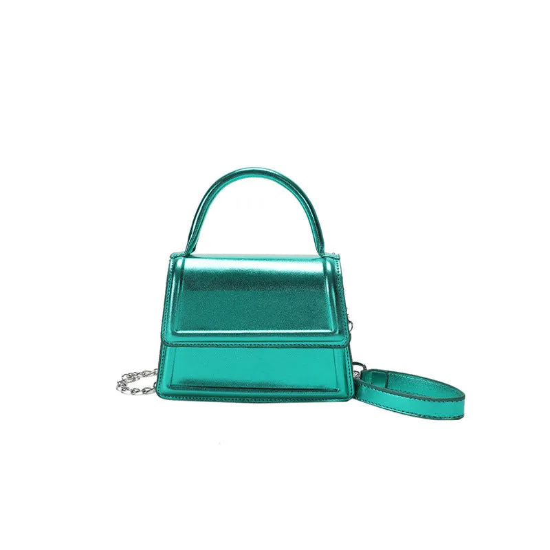 Retro shoulder bag with horizontal square shape in silver colour showing sewing line details