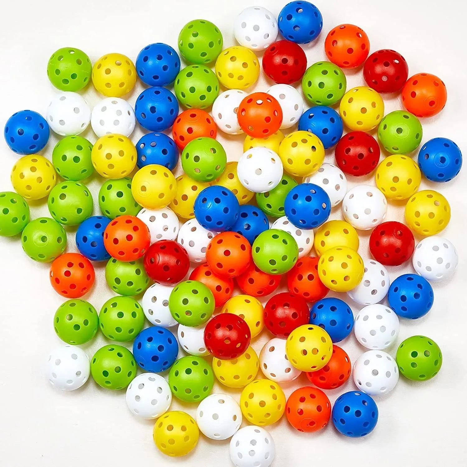 Multi-colour golf practice balls showing red, orange, blue, green, white and yellow variants with 26-hole design