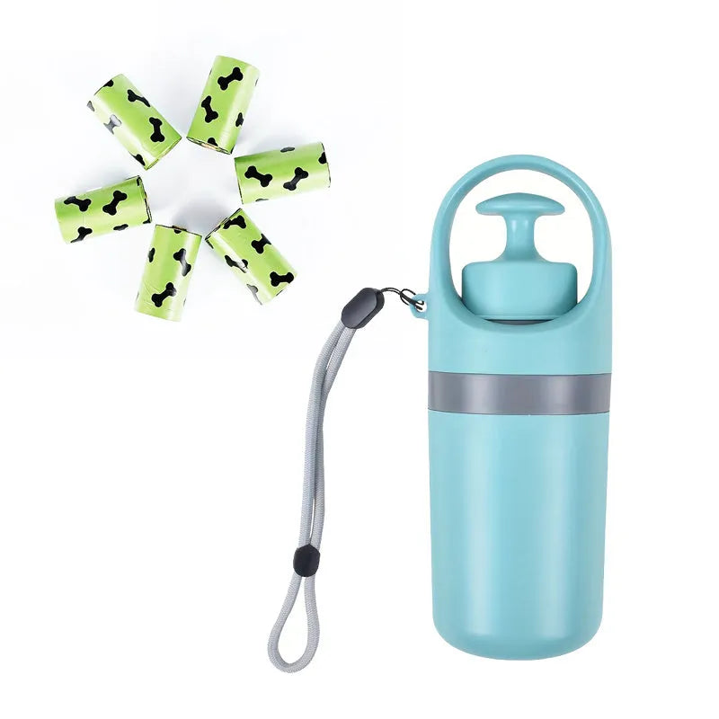 Blue portable dog poop scooper with built-in bag dispenser, clipped to a dog leash