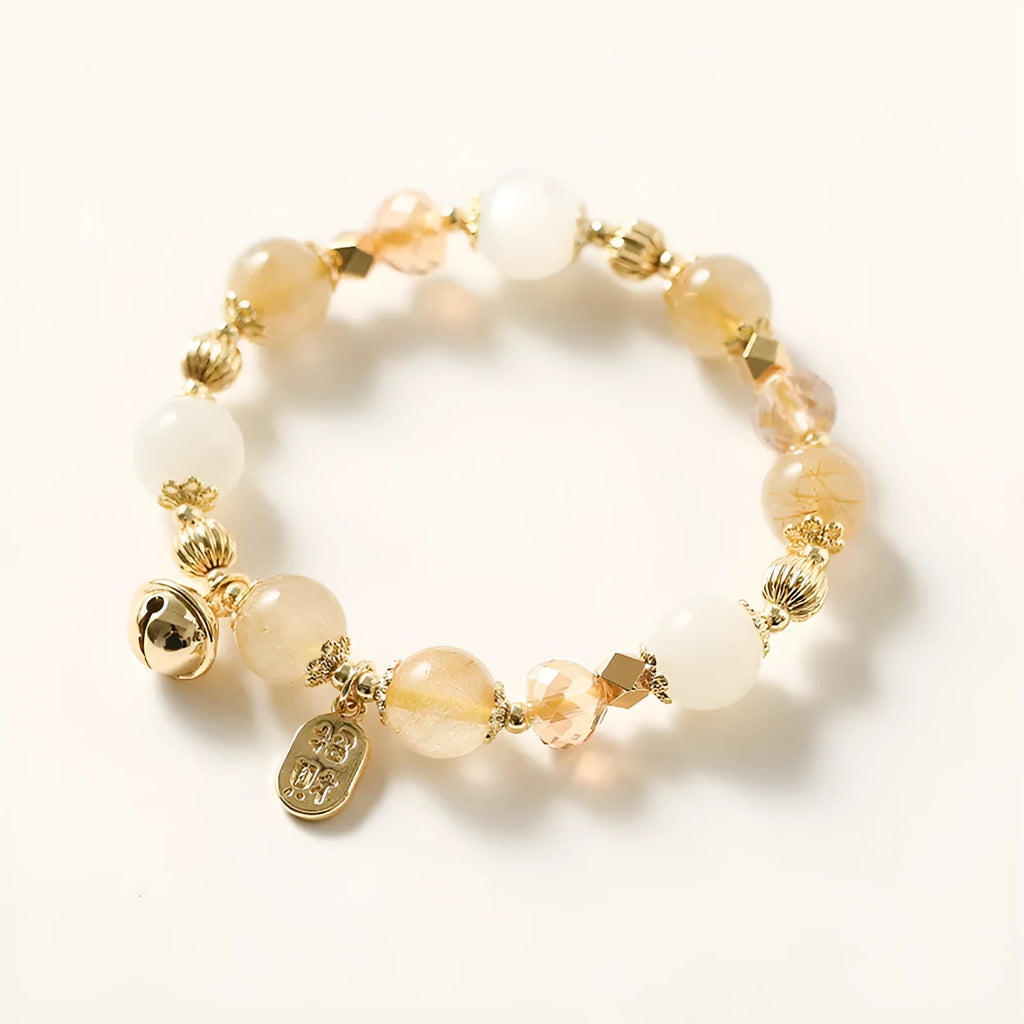 Gold coloured rutilated quartz bracelet with Korean style design on wrist