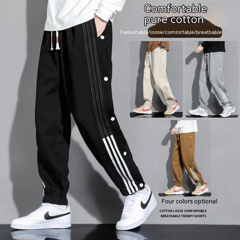 Men's black loose-fit cotton blend sweatpants with ankle ties and a drawstring waist.