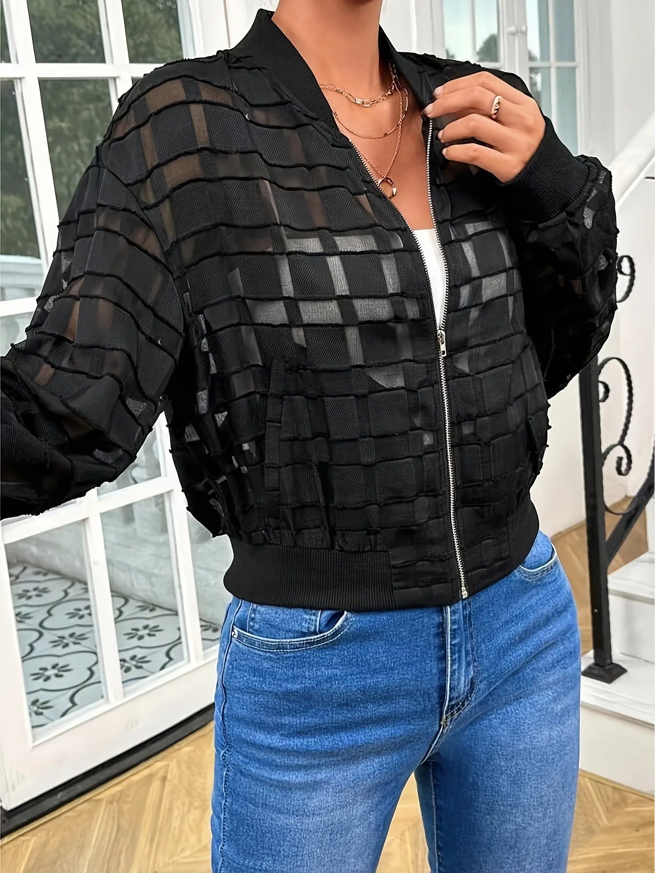 Black women's casual jacket with geometric pattern, front zipper, and long sleeves
