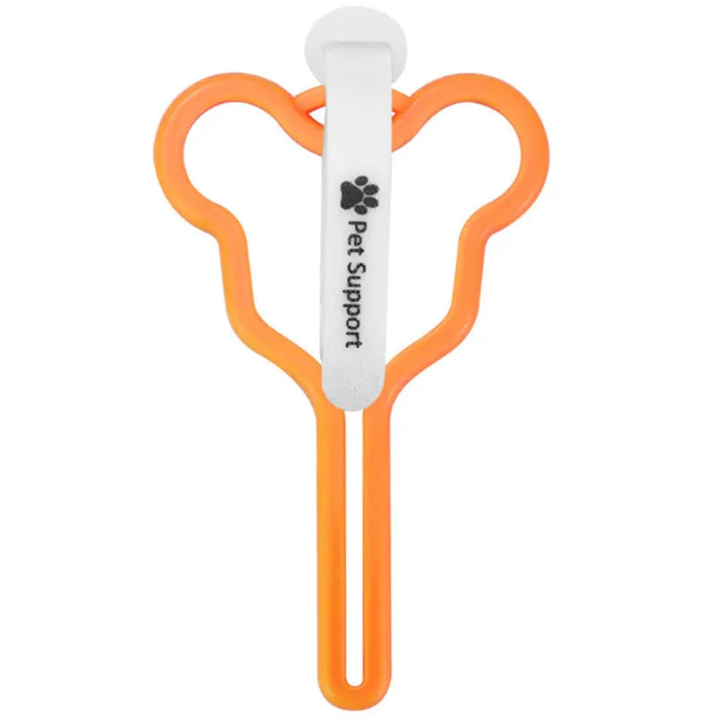 Dog poop bag holder with fixed clip and adjustable Velcro fastener on a leash.