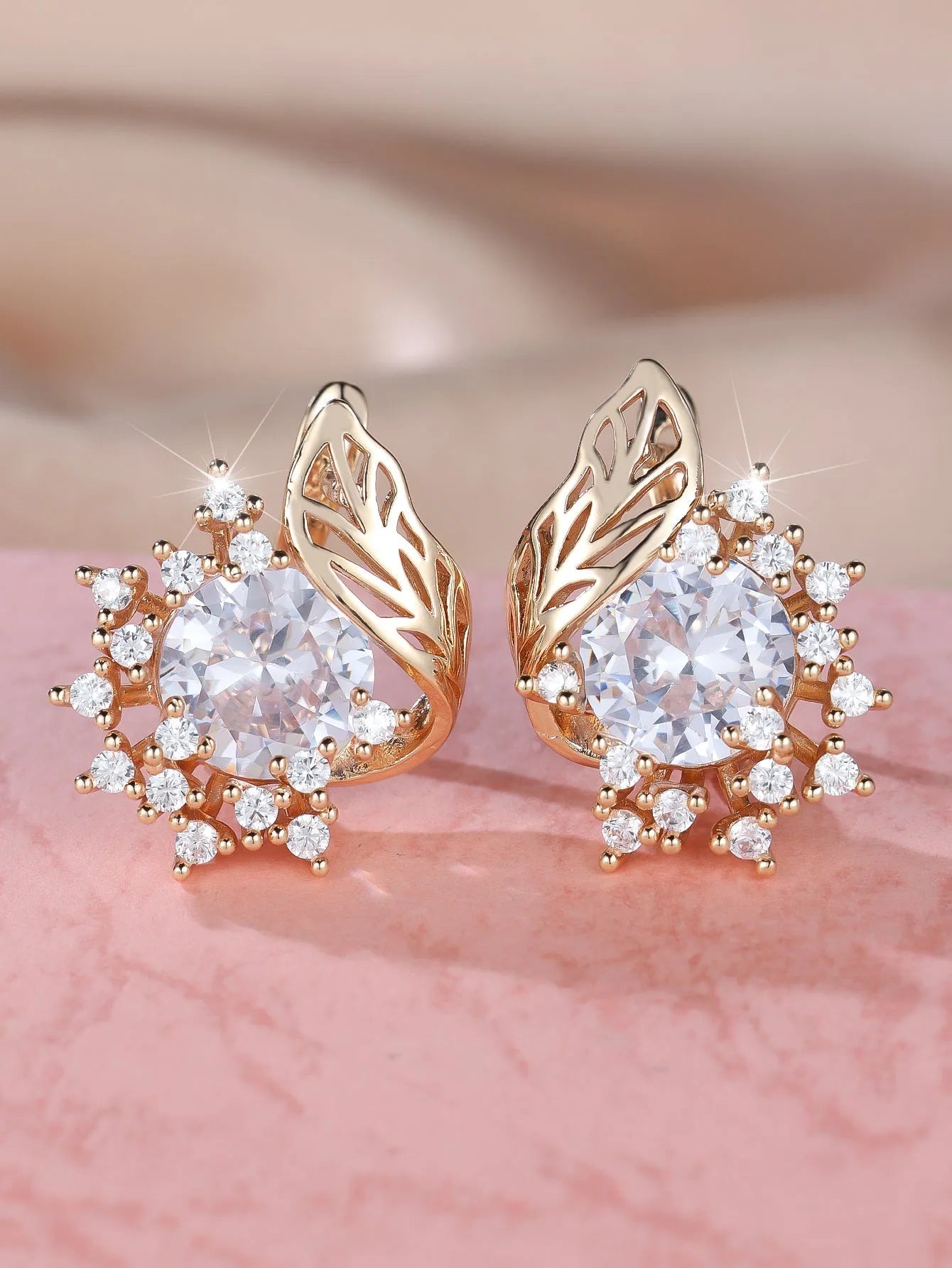 Round flower feather design earrings with champagne gold setting and coloured zircon stones.