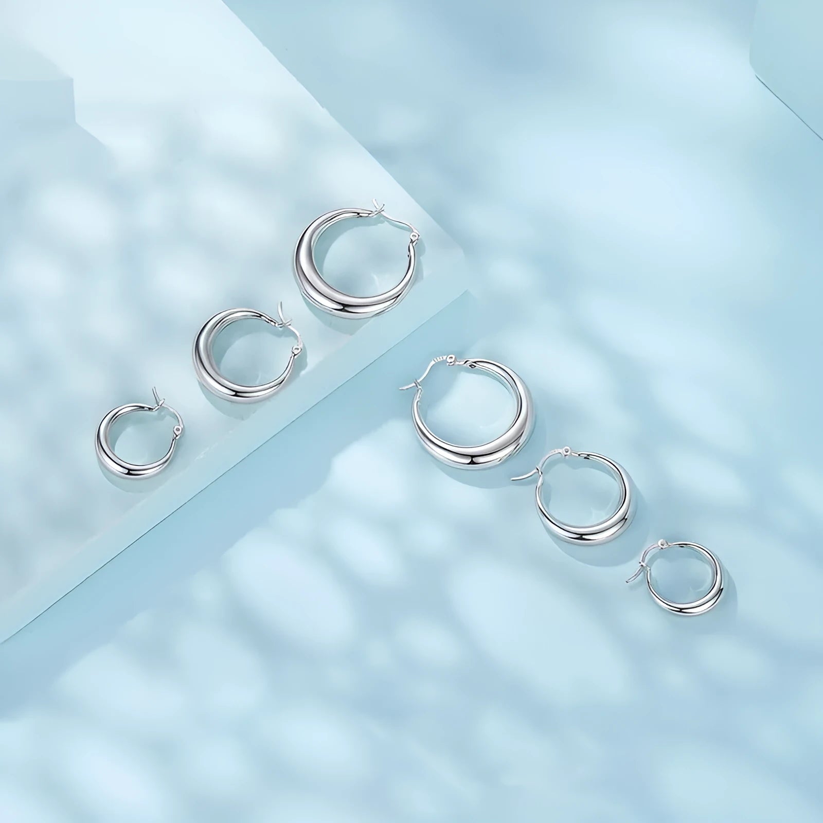 Geometric ring clip-on earrings with copper base and silver electroplated finish