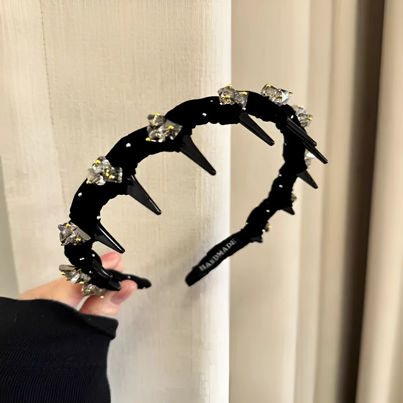 Women's non-slip velvet hairband with crystal wave detail in wine red colour.