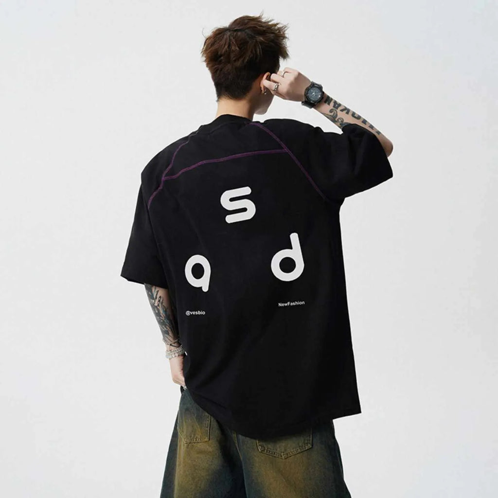 Black loose fit cotton T-shirt with short sleeves and a round neck collar featuring a letter print