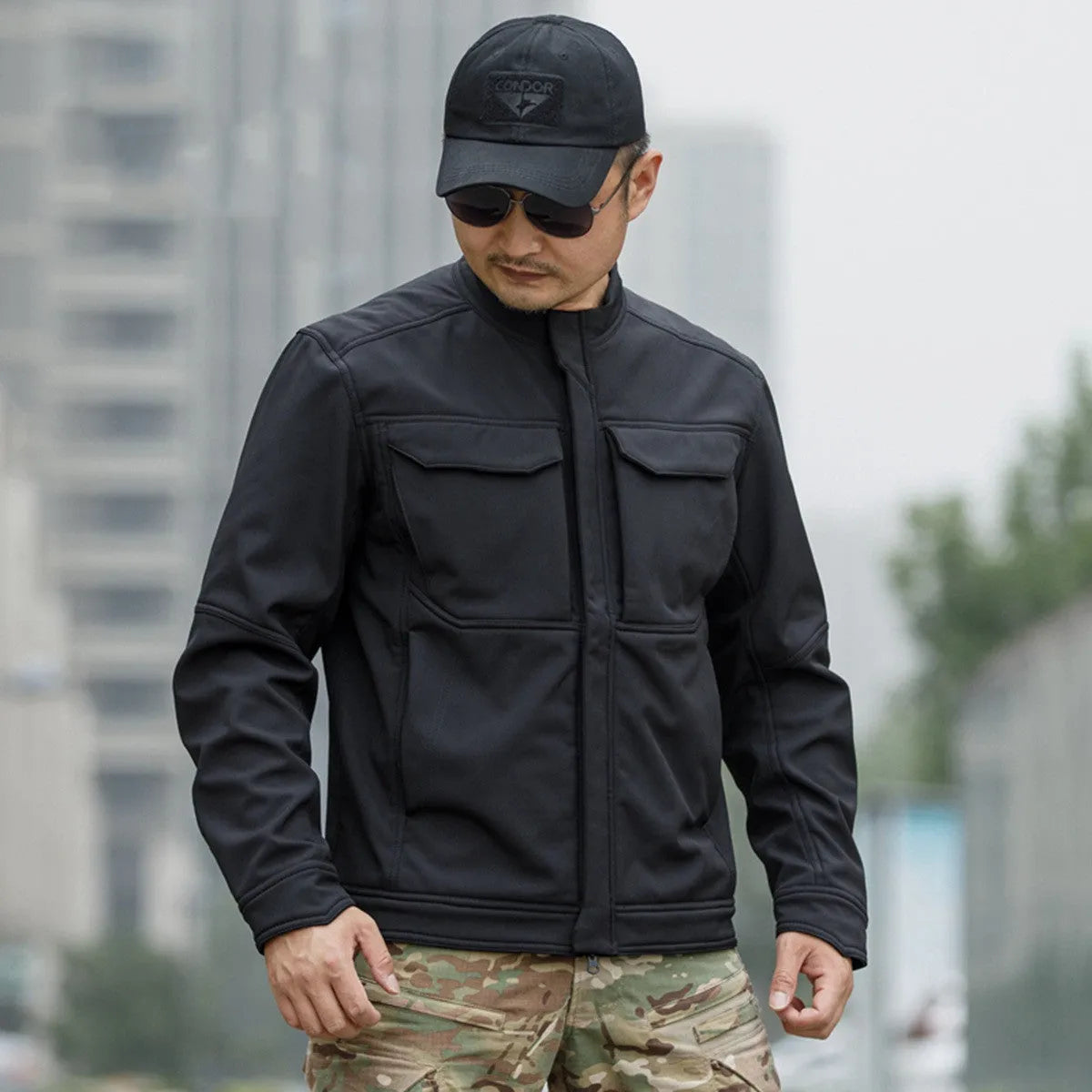 Bone Frog Peak Breaker soft shell jacket in black camouflage for outdoor mountaineering and tactical use.
