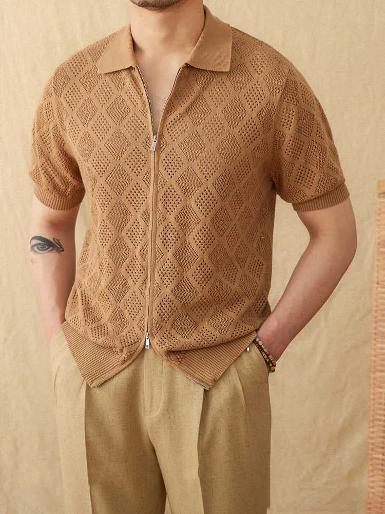 White cotton zip-front cardigan with lapel collar and short sleeves laid flat.