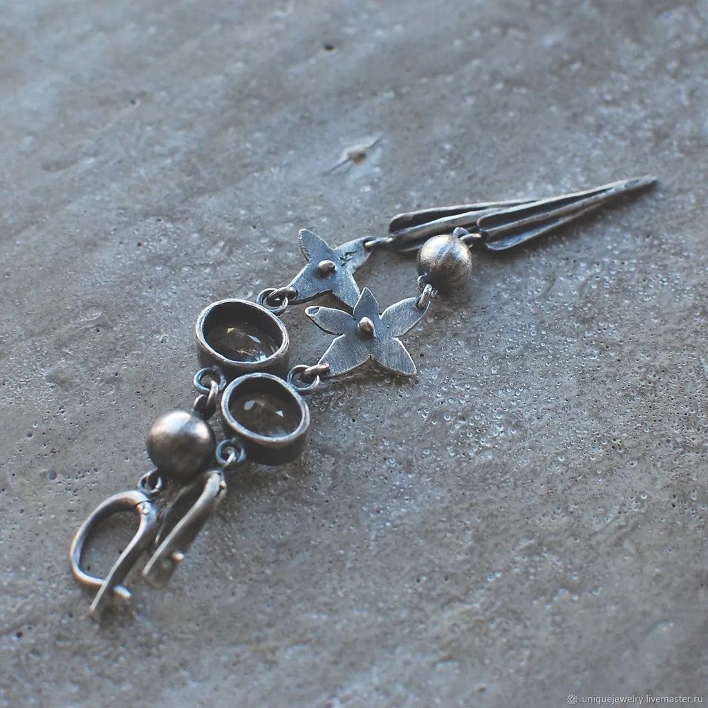 Geometric long pendant earrings with XINGX design and rhinestones in antique silver