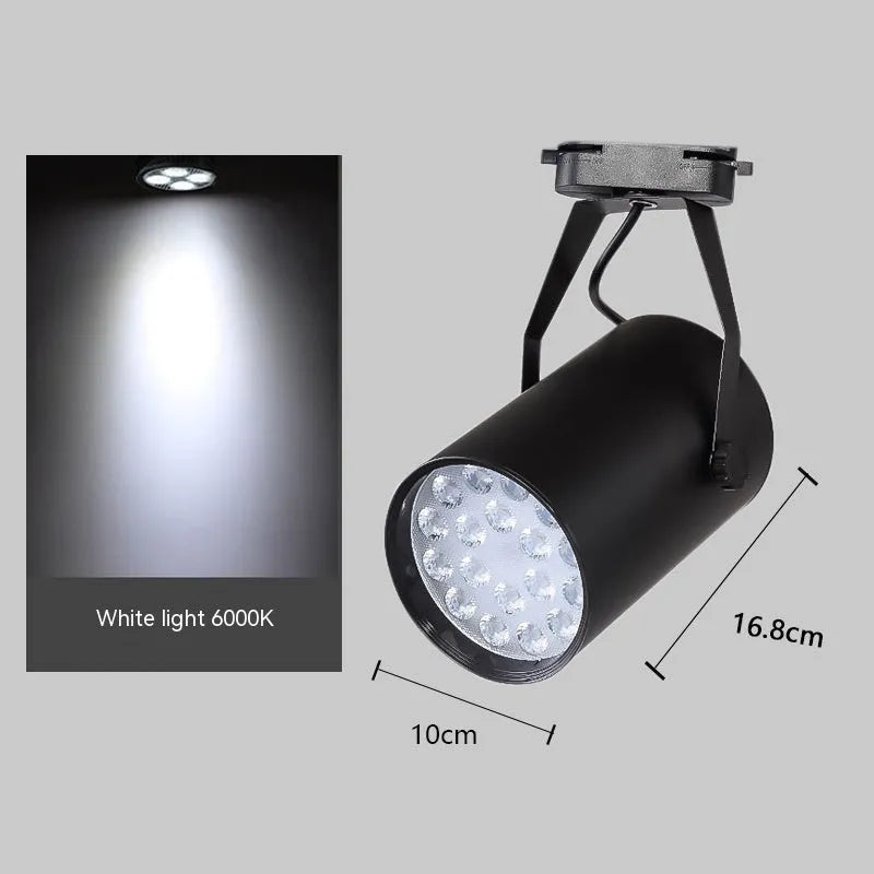 LED track spotlight with aluminium shell in black or white, for clothing store wall lighting.