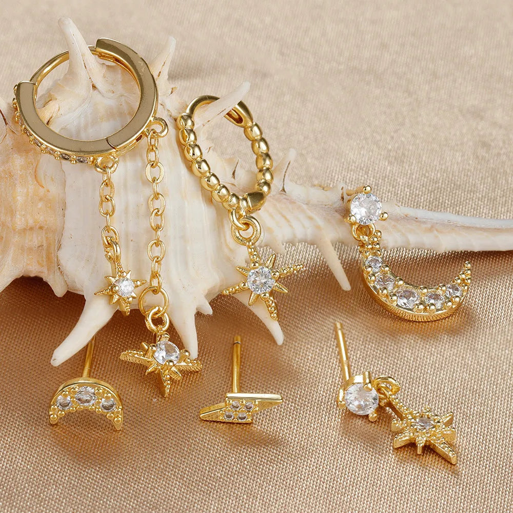 Six pairs of gold electroplated earrings including chain tassel designs and zircon studs for women
