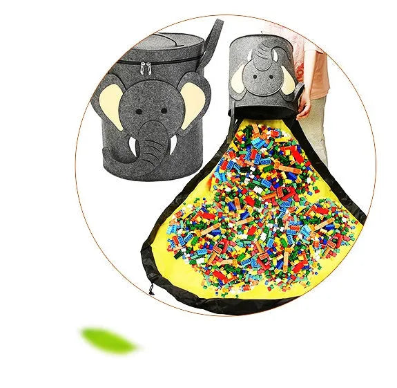Green felt cube storage bag with a pull rope, shown unfolded as a flat play mat for toys.