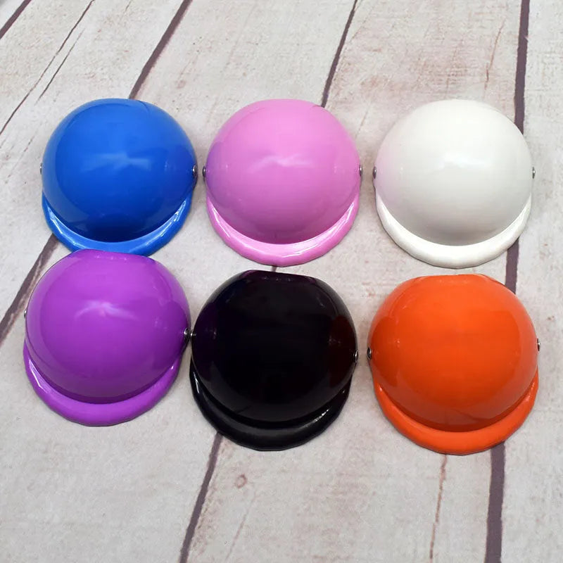 A solid colour plastic motorcycle-style helmet for a dog, shown in one of seven available colours.