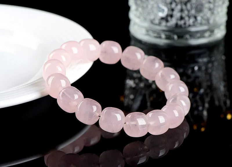 Pink crystal barrel bead bracelet with geometric design and 11-12mm beads
