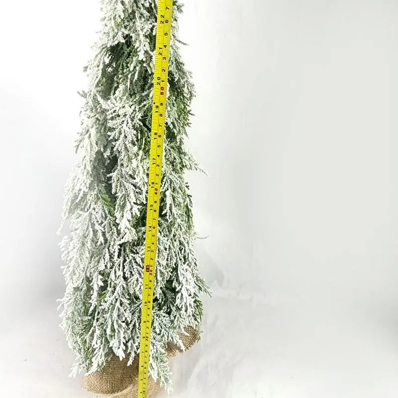 Small 24-inch white plastic Christmas tree with lights and snow sprayer decoration