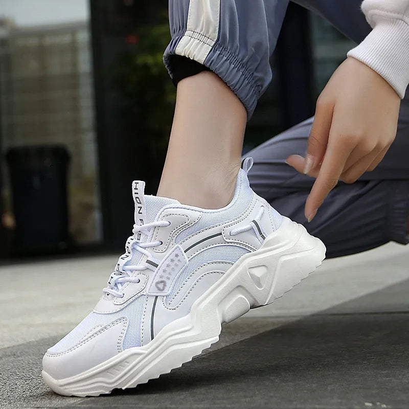 Women's white and moonlight coloured sports shoes with mesh upper and thick sole