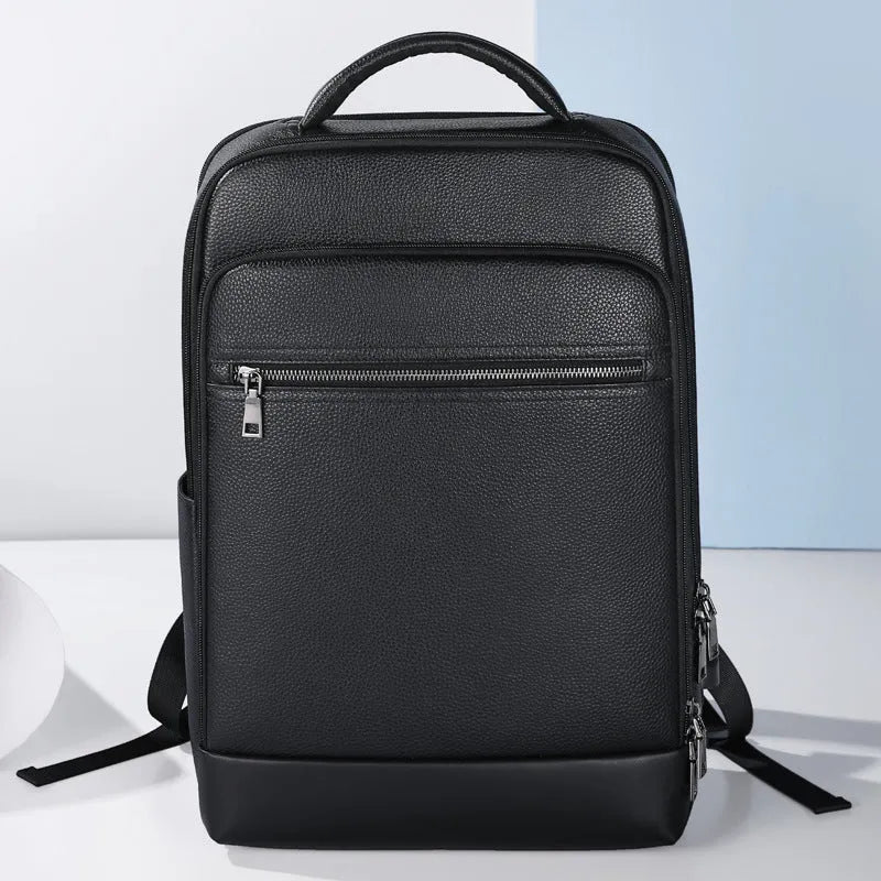 Black genuine leather men's business computer backpack with curved shoulder strap and sewing line detailing