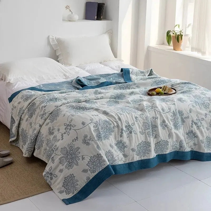 Five-layer pure cotton gauze bed blanket in modern simplicity style, shown in blue roulette wheel pattern.