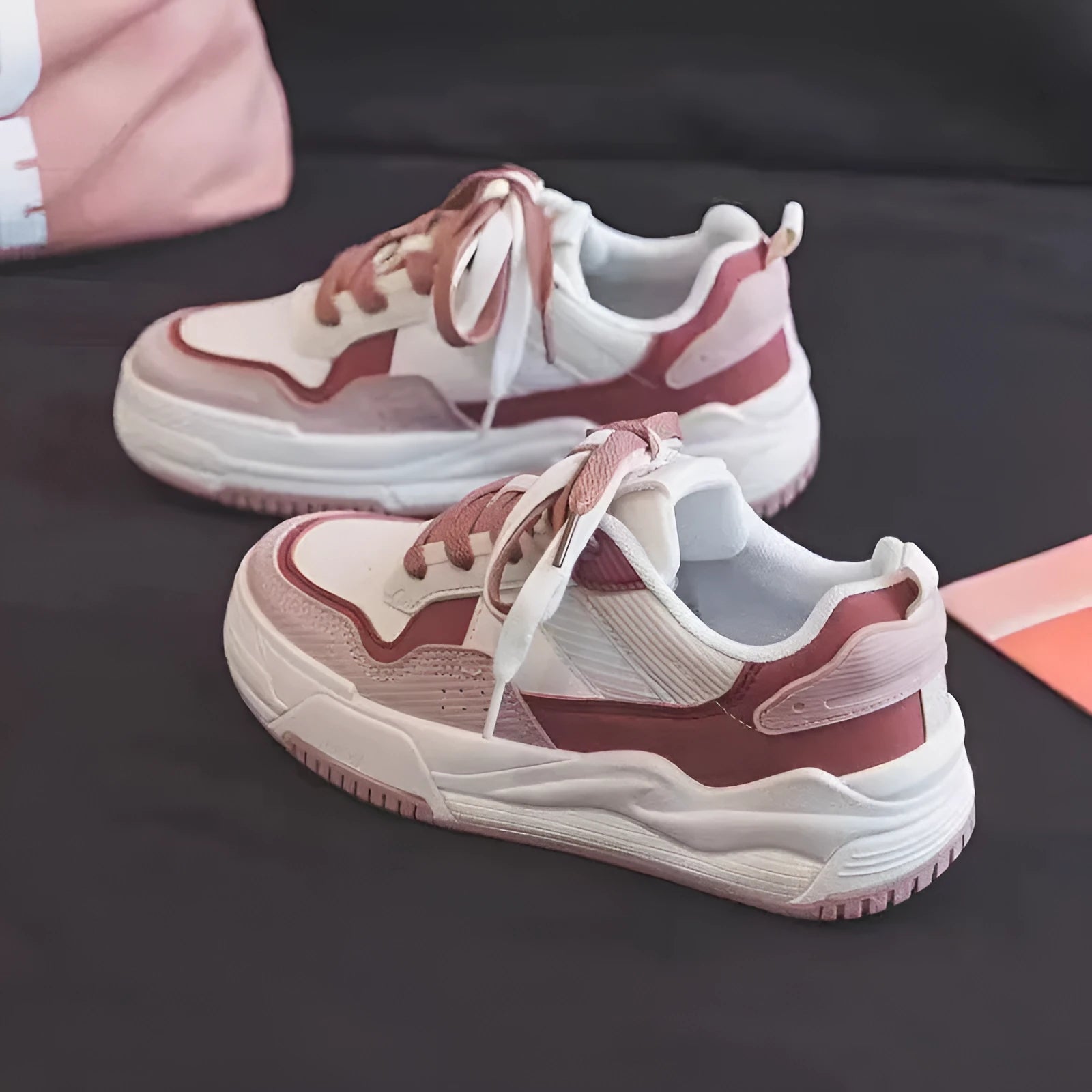 Pink and milky white low-top rubber sole sneakers with height increasing function