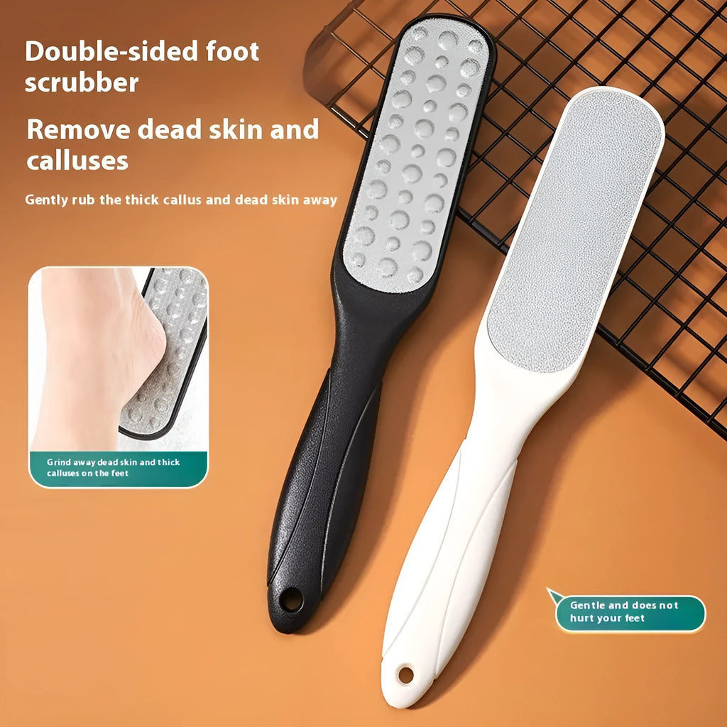 Stainless steel foot grinder tool with white and black double-sided abrasive files for callus removal.