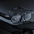 Black smart Bluetooth glasses with head-mounted video recording camera showing touch buttons and optional memory card slot