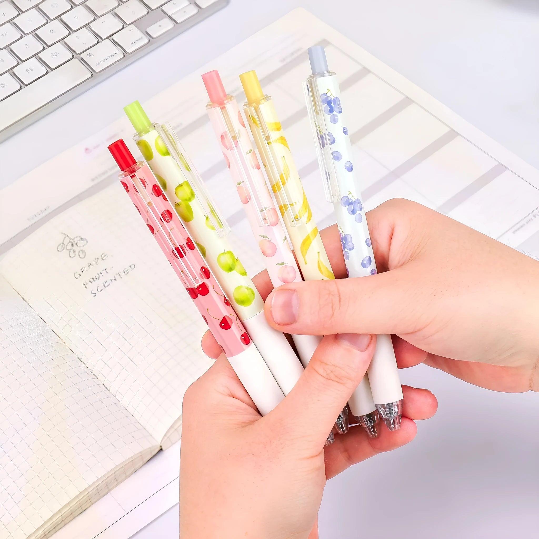 Three fruit scented pressurised pens with 0.5mm black refills and replaceable cartridges