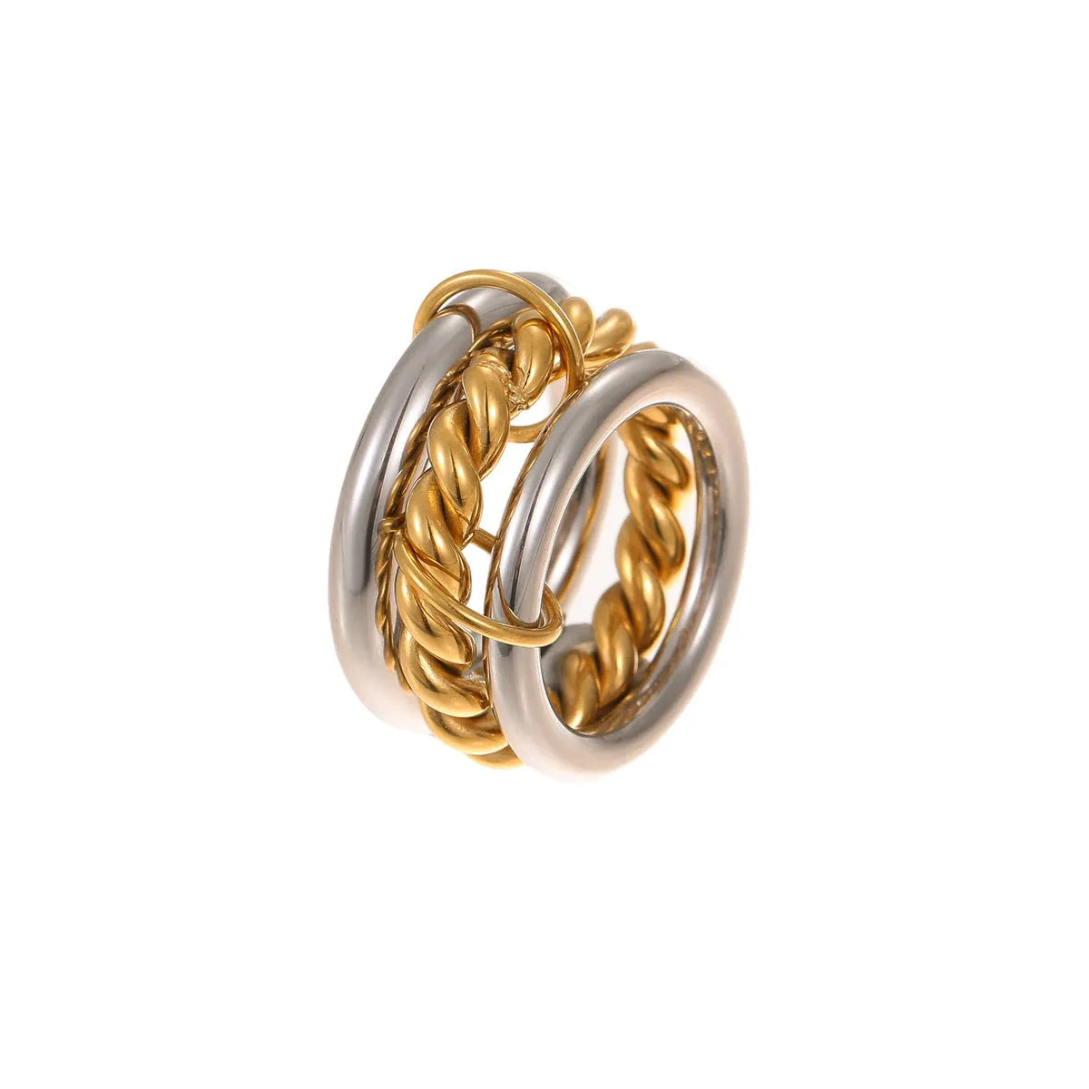 Stacked stainless steel rings with gold plating in coordinated colours showing layered hand jewellery design