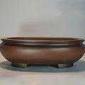 Handmade classical purple clay sand flowerpot on a desktop, showing its 58cm length and 18cm height.