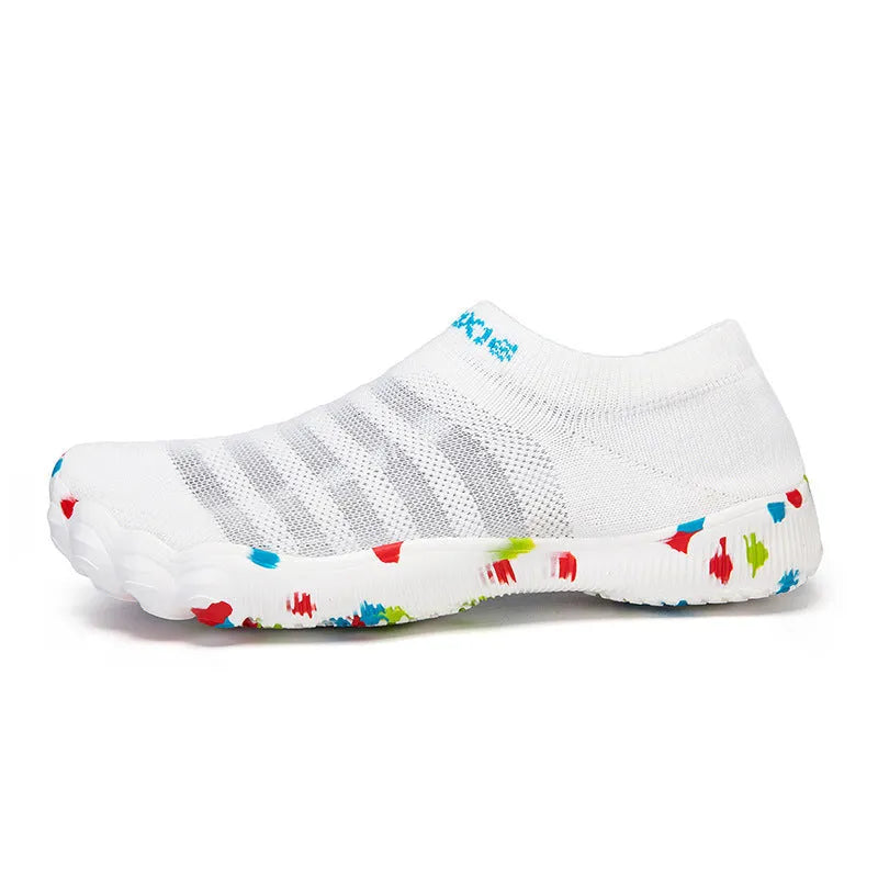 Camouflage pattern water shoes with Flyknit upper and rubber sole, shown on a rocky shore.