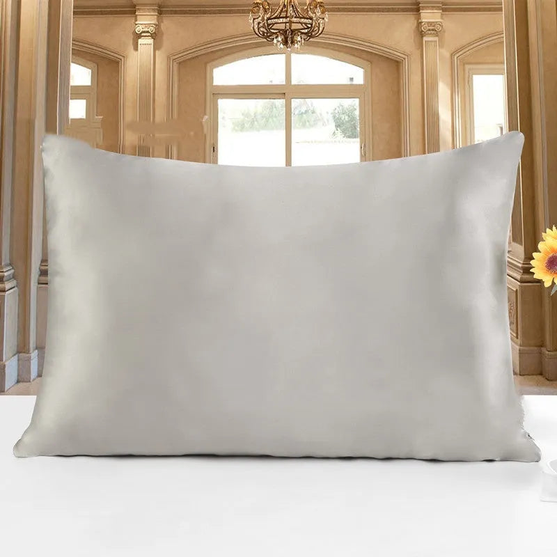 19 M double-sided silk pillowcase in apricot colour, showing envelope closure and smooth fabric texture.