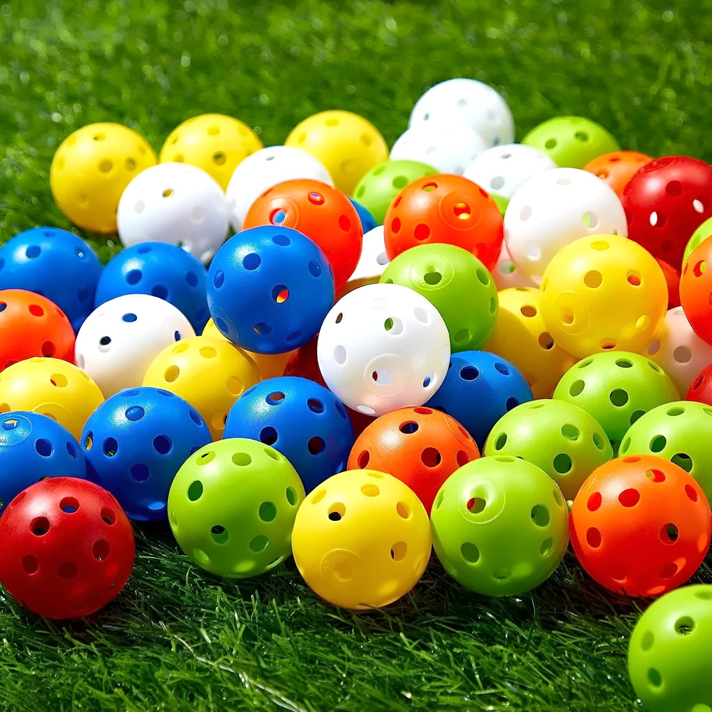 Multi-colour golf practice balls showing red, orange, blue, green, white and yellow variants with 26-hole design