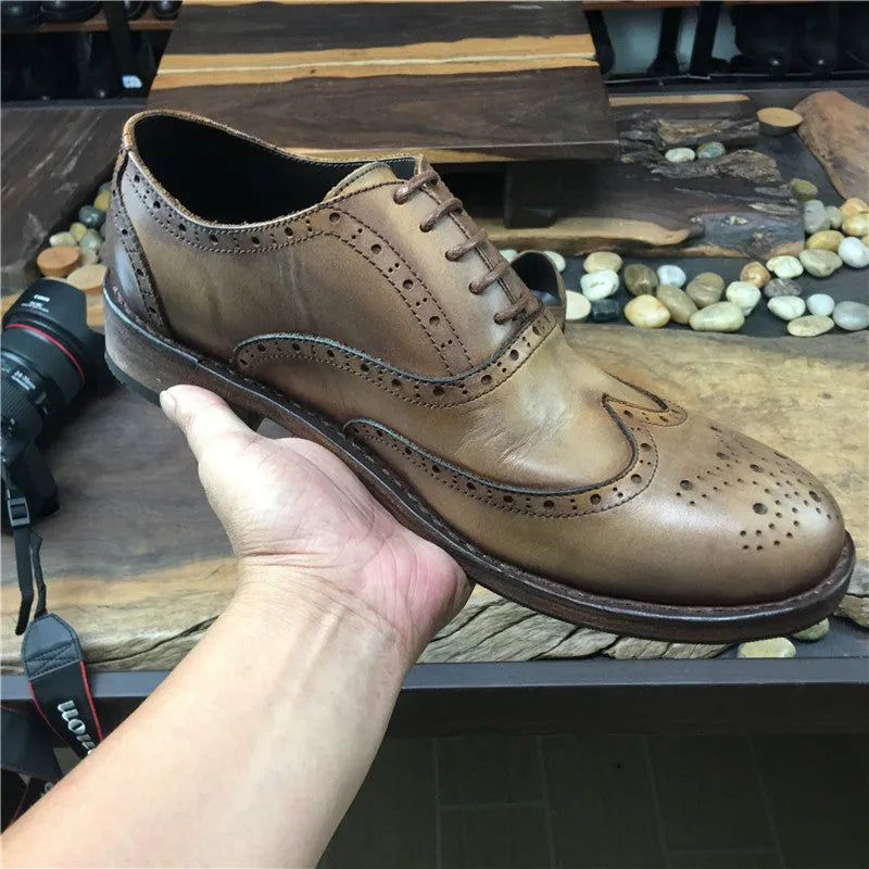 Men's light brown vintage leather shoes with engraved distressing and lace-up closure